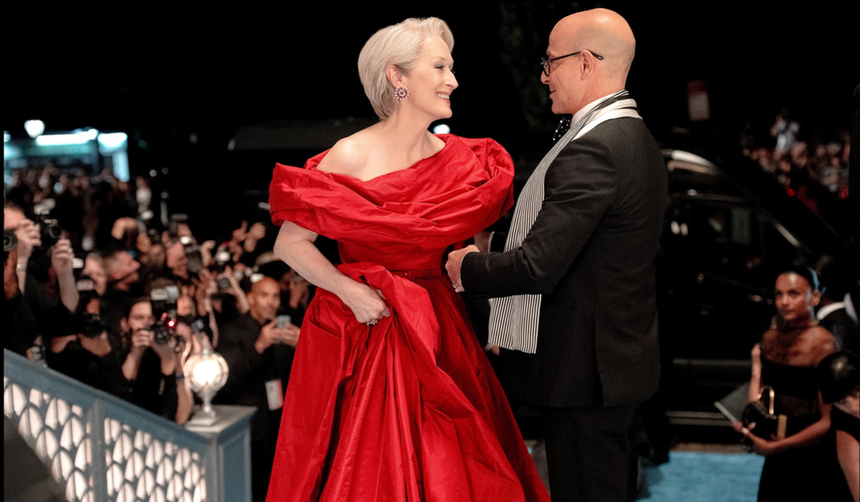 Meryl Streep in red voluminous gown and Stanley Tucci in a suit in The Devil Wears Prada 2.